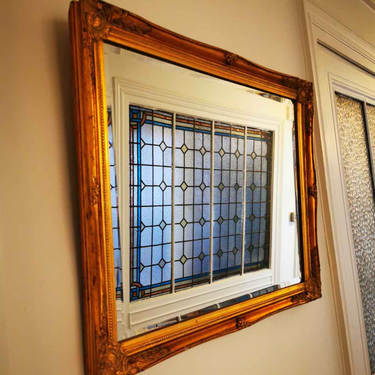 Miroir ancien style Napoléon 3 motif fleuris aux coins