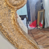 Grand miroir baroque décoré de volutes