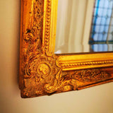 Miroir ancien style Napoléon 3 motif fleuris aux coins