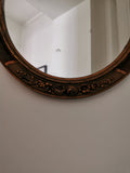 Miroir ovale doré et bois